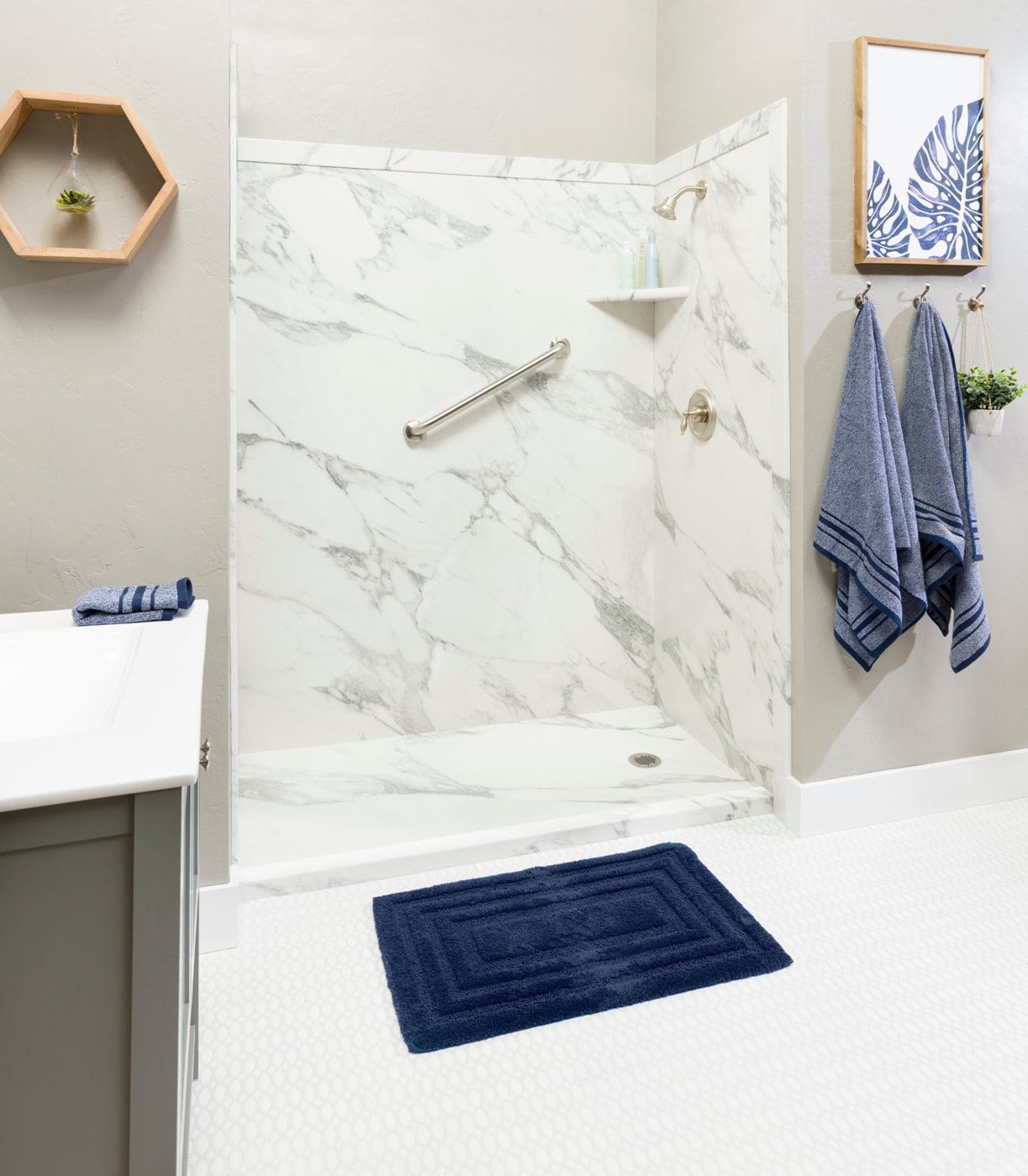 Walk-in shower with white marble-look wall panels